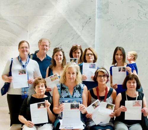Group of Herd on the Hill volunteers holding letters from constituents to be delivered